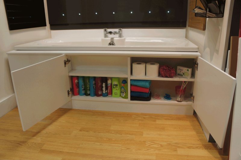 A cabinet under the bathroom