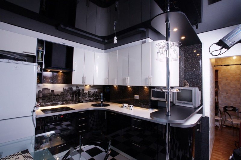 Black kitchen with a bar