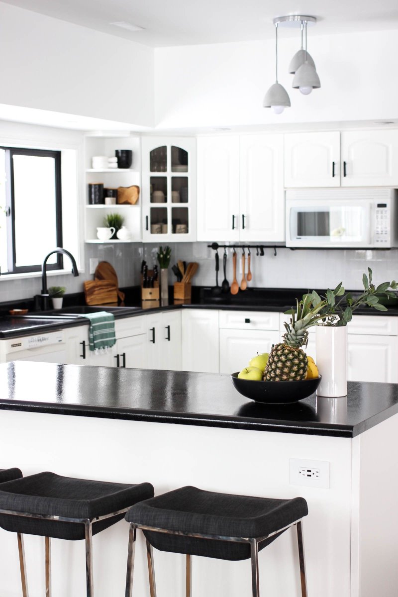 White kitchen with a black countertop