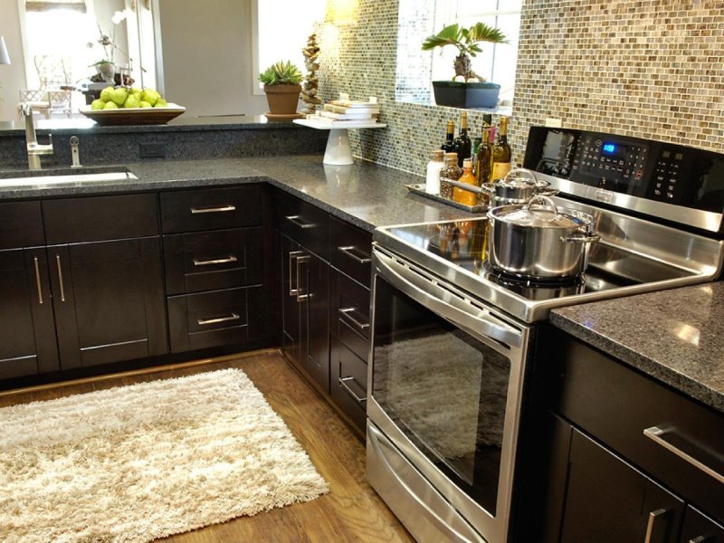 Dark kitchen with a black countertop