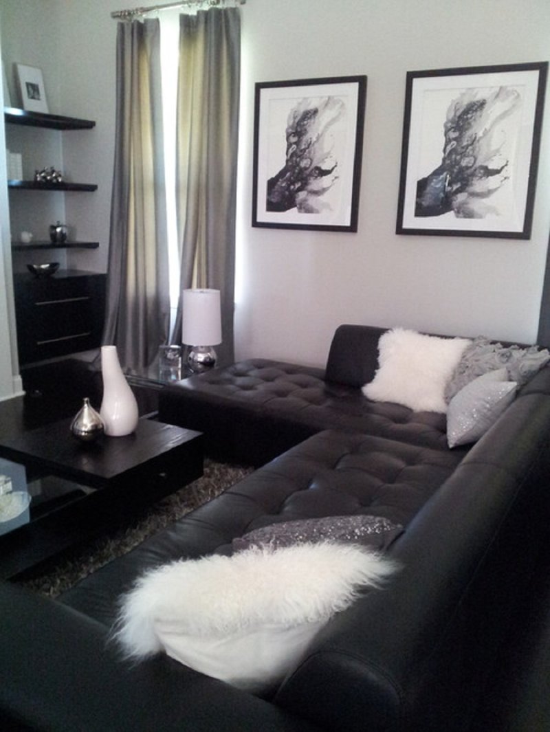 Black sofa in the interior of the living room