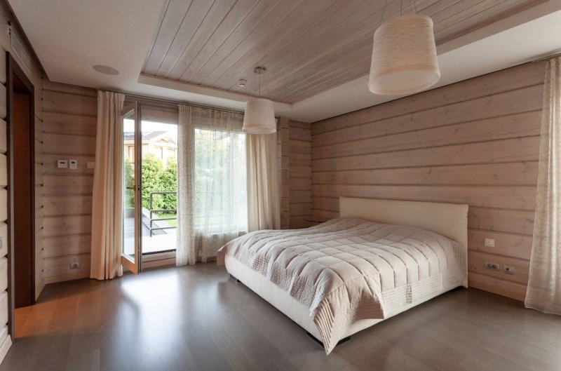 Bedroom in a house made of glued beams