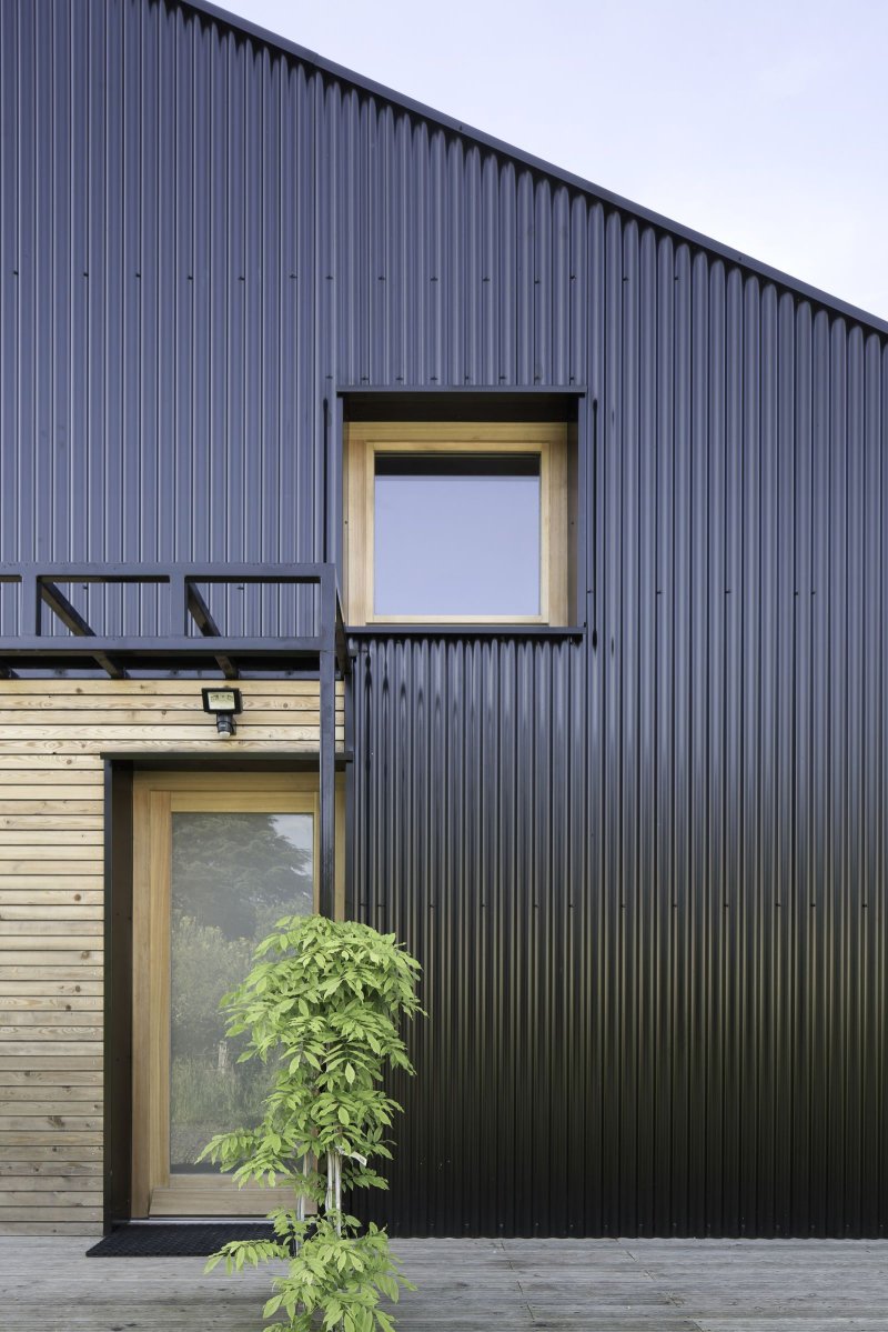 Corrugated board for the facade of the house