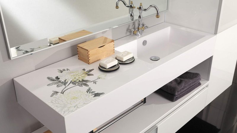 Sink color and style of Styllo 127 with a towel