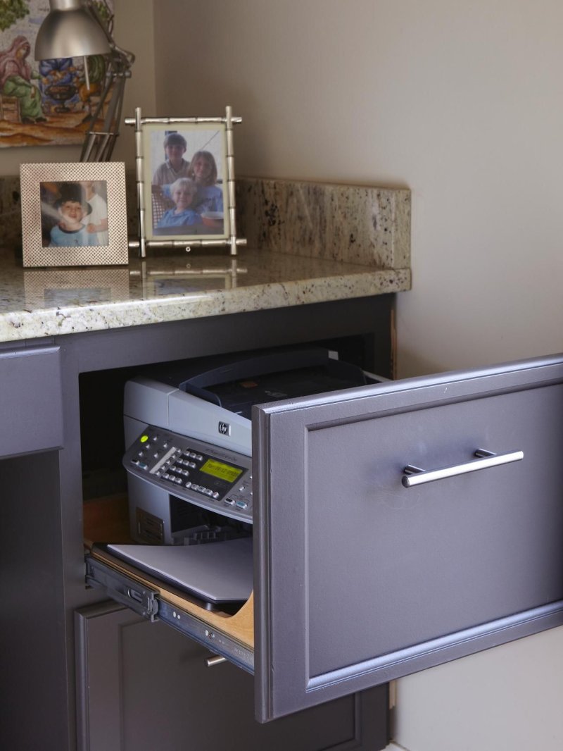 Printer in a sliding cabinet