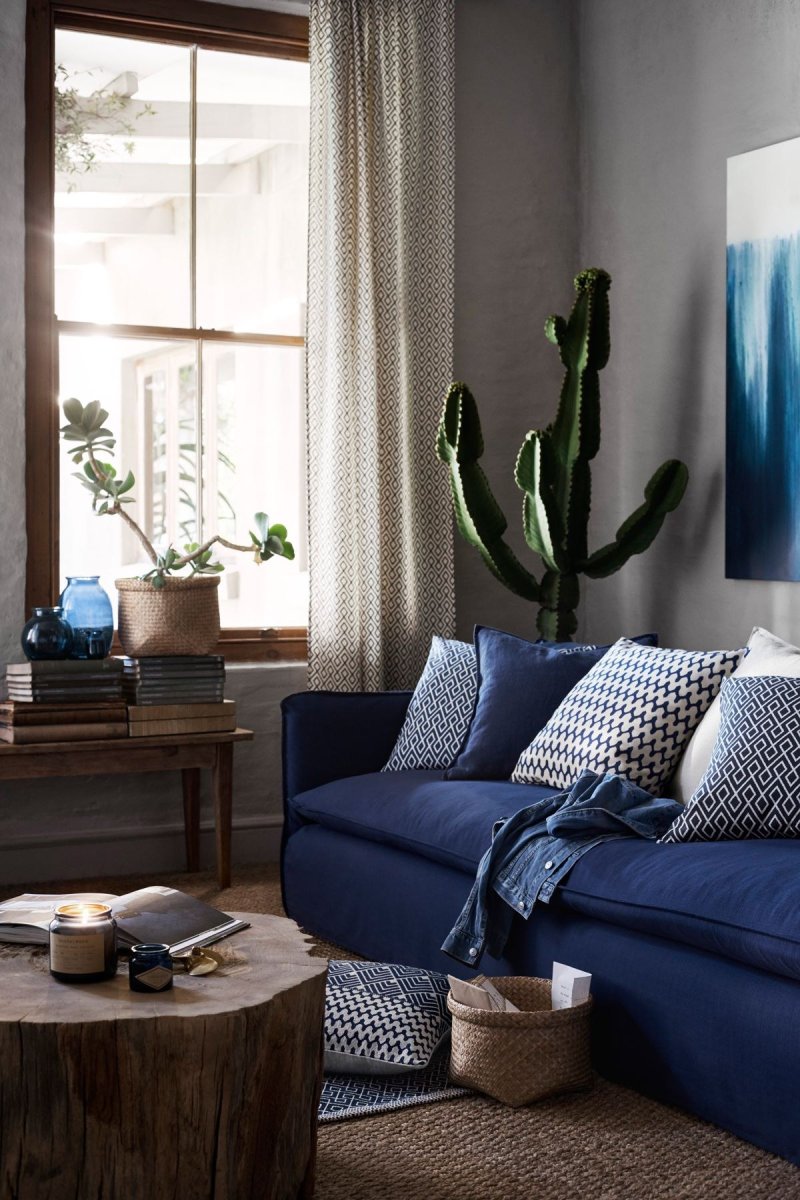 Blue sofa in the interior of the living room