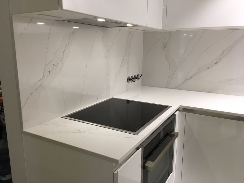 White kitchen with a marble tabletop