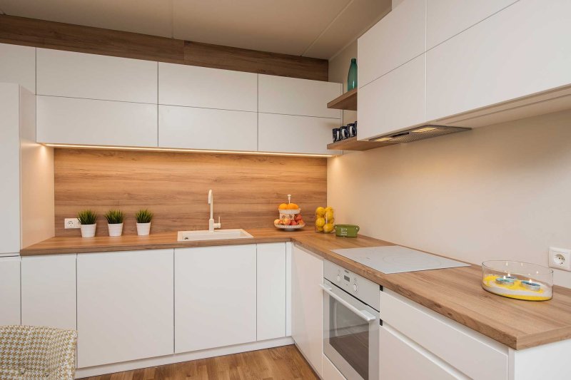 Kitchen with a wooden countertop and an apron under a tree