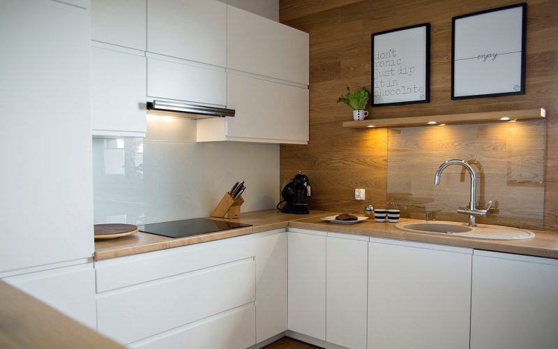 White kitchen with a wooden countertop