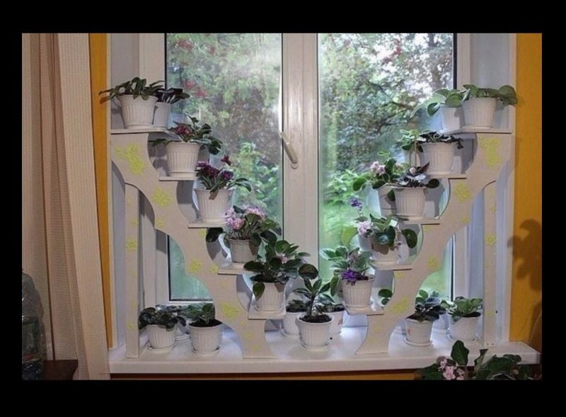 Shelves for flowers on the windowsill