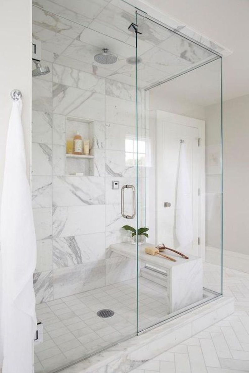 Bathroom design with a shower partition made of glass