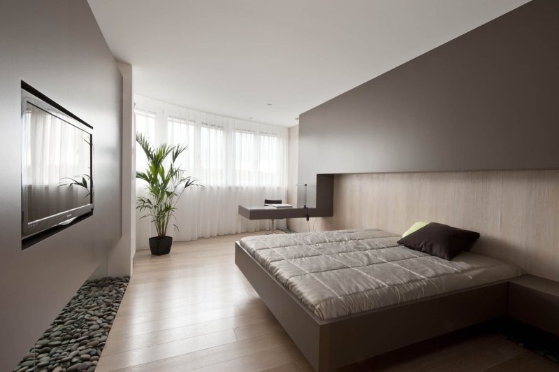 The design of the bedroom in the modern style of minimalism