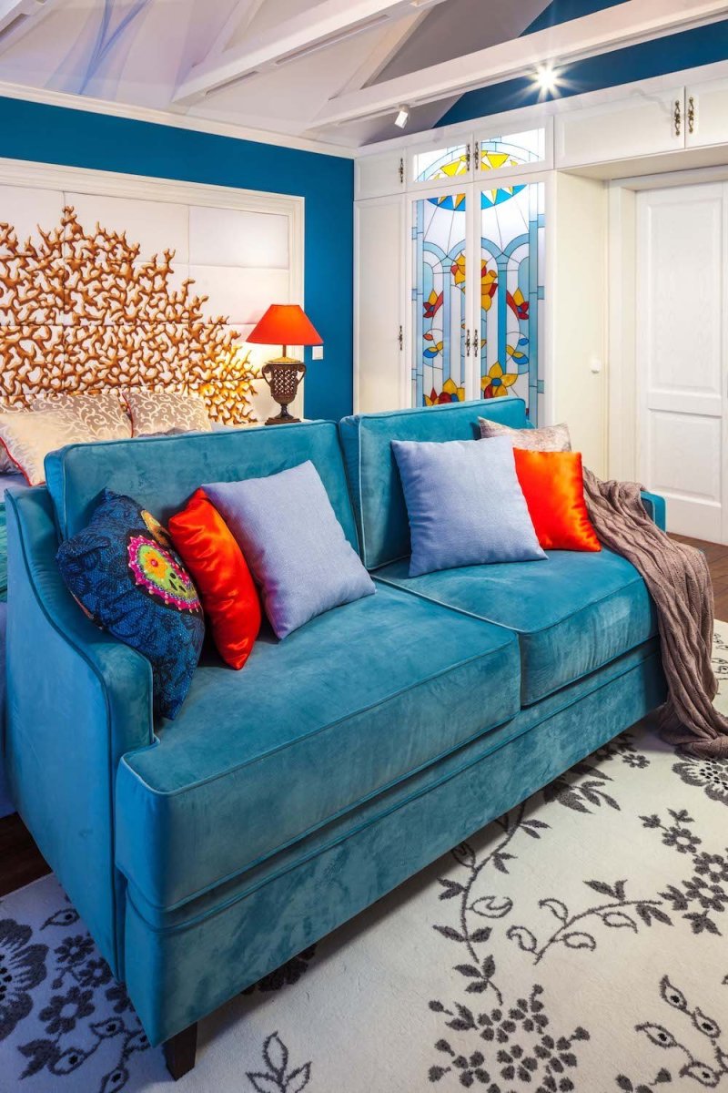 Interior with turquoise sofa