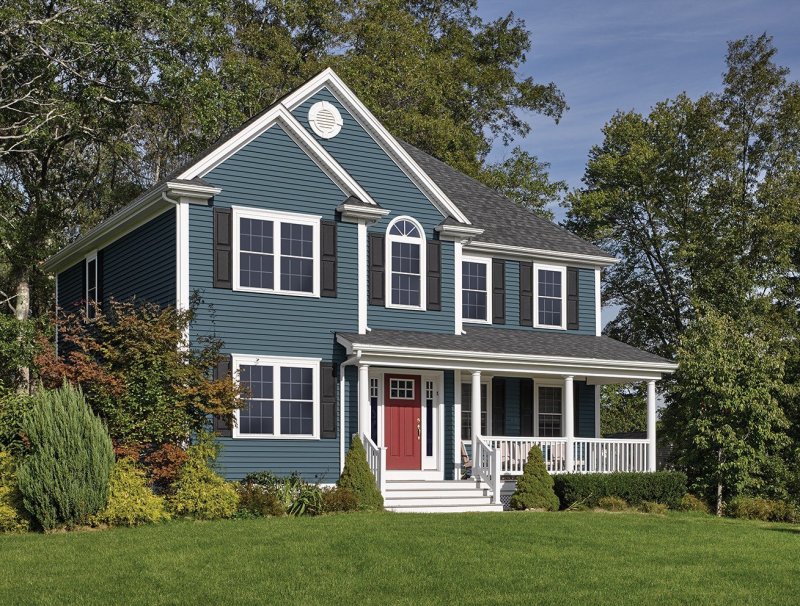 House sheathed with gray siding