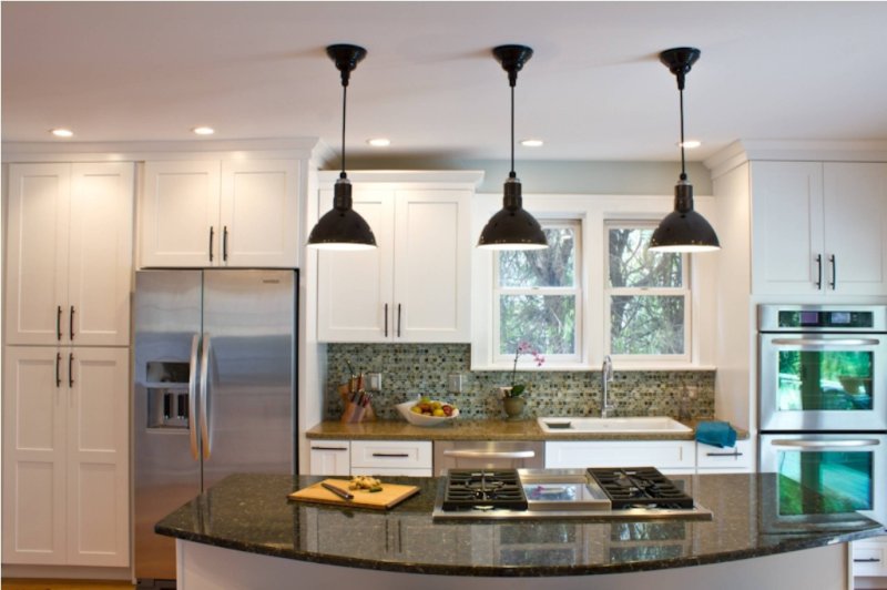 Lamps above the bar in the kitchen suspended