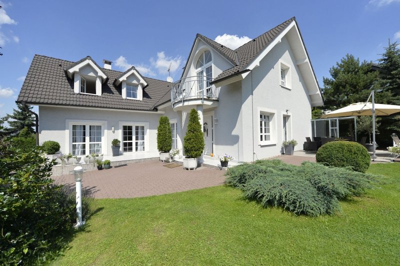 White facade of the cottage