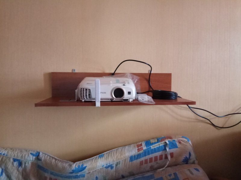 Shelf for the projector on the wall