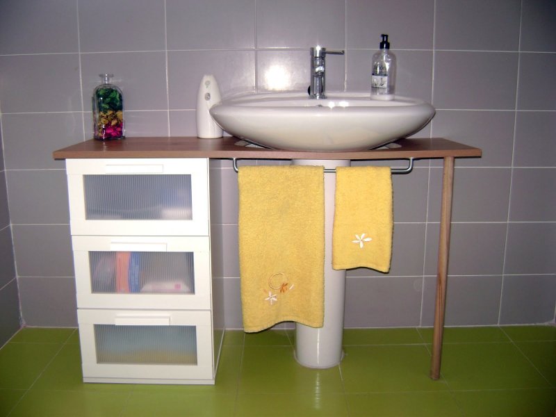 Shelf under the sink in the bathroom