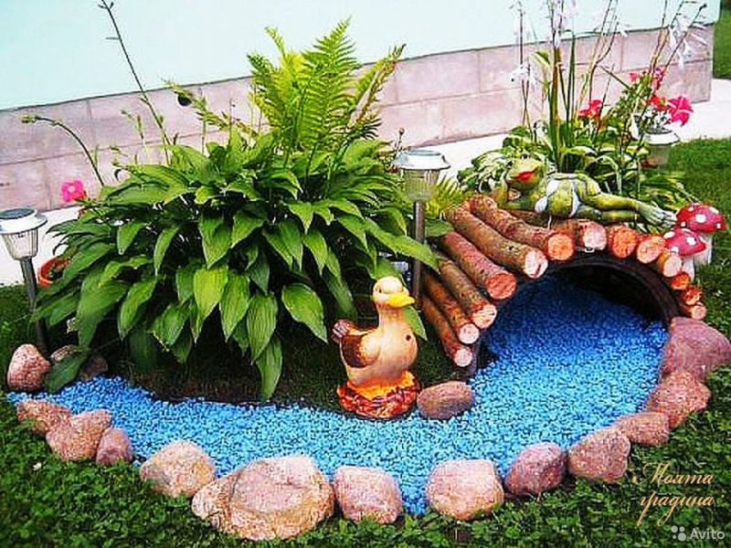 Decorative bridge on the flowerbed