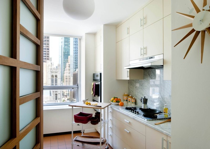 The interior of a narrow kitchen