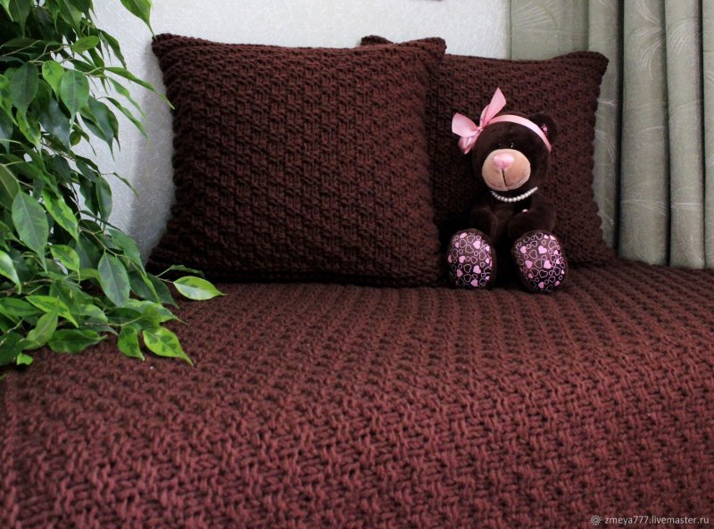 Knitted bedspread on a sofa