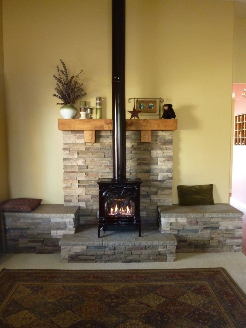 Wall decoration behind the stove fireplace