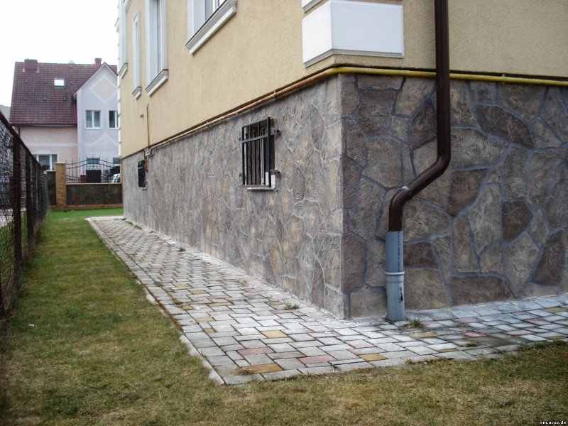 Facing the basement with a stone