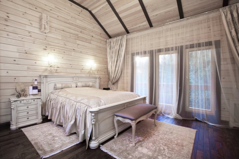 Bedroom interior in a wooden house