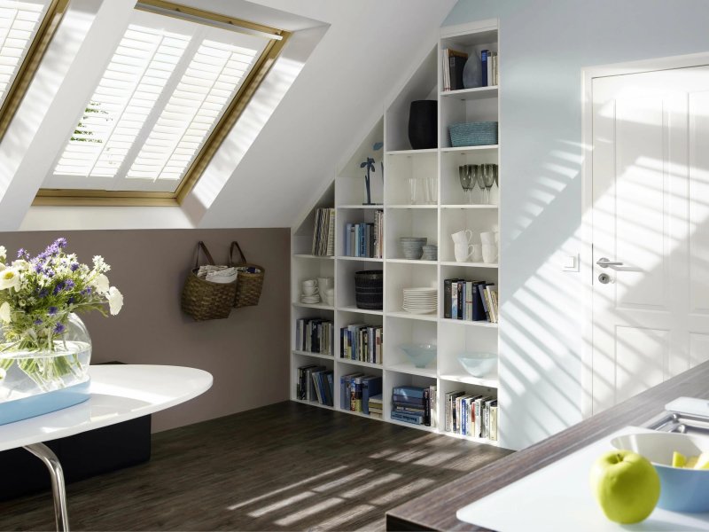 Bookcase on the attic under the bevel