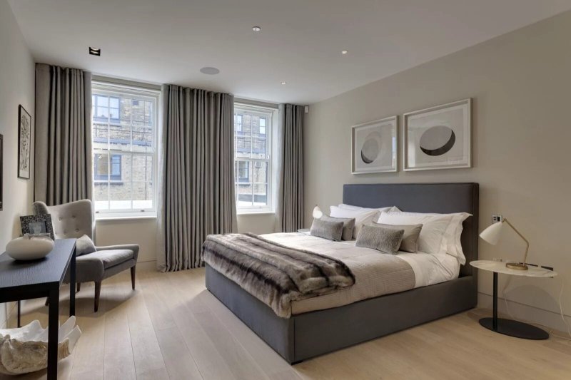 Gray curtains in the interior of the bedroom