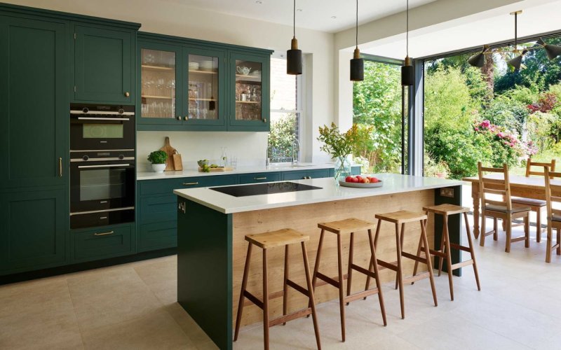 Dark green kitchen in the interior