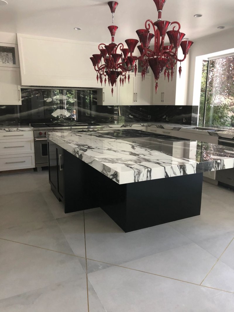 White kitchen countertop black marble