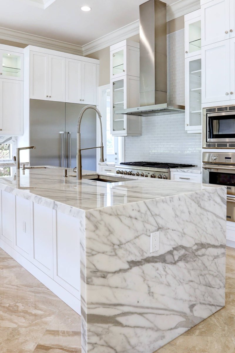 White kitchen with a marble tabletop