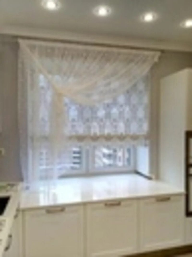 Roman curtains with a kitchen tulle