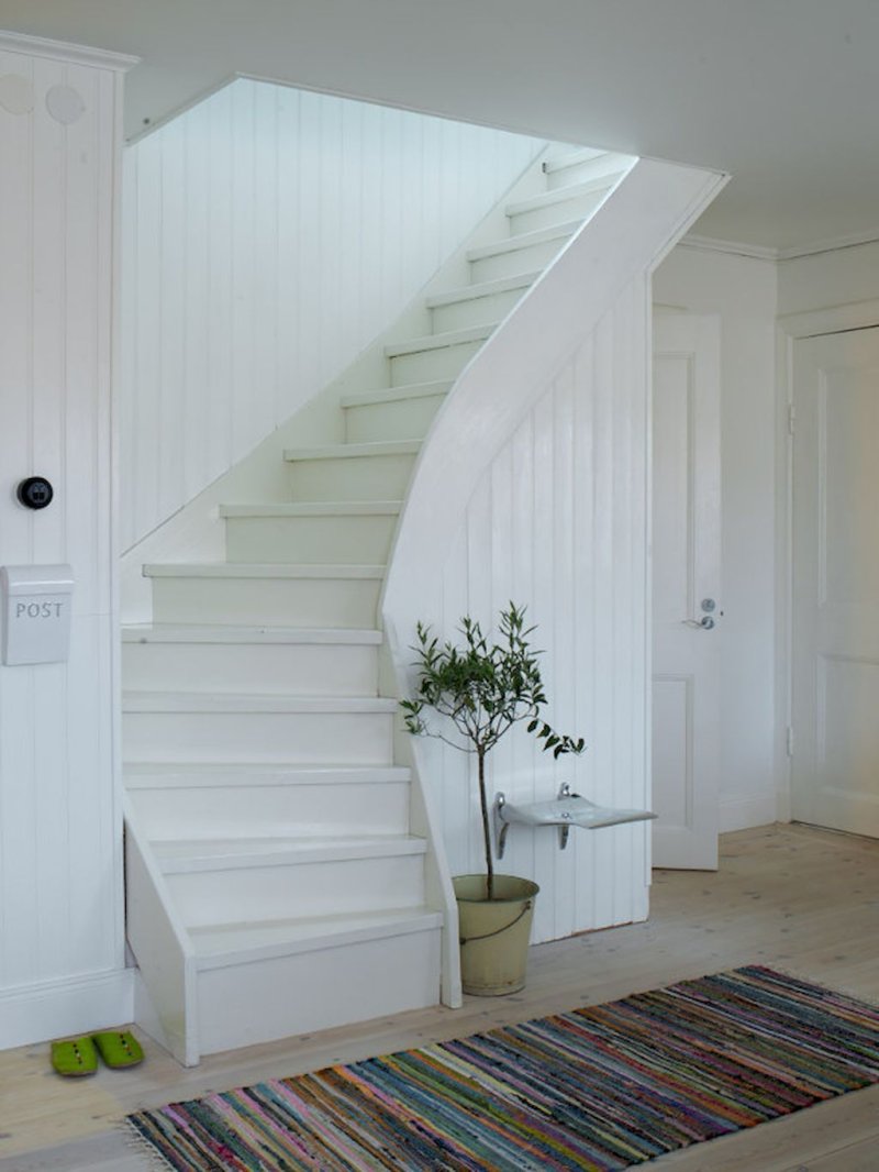 White wooden staircase in the interior