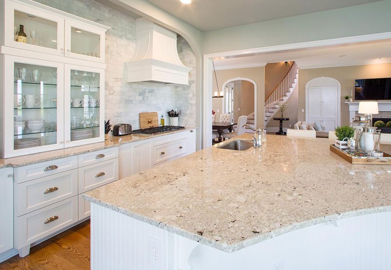 White kitchen with a granite tabletop