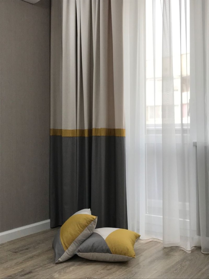 Yellow curtains in a gray interior