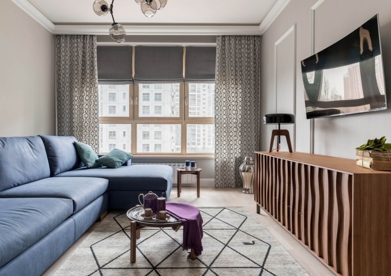 Roman curtains in the interior of the living room in a modern style