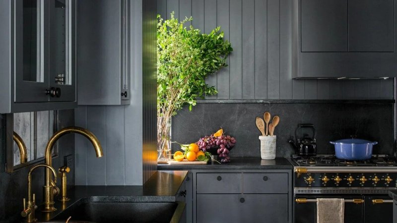 Dark gray kitchen in the interior