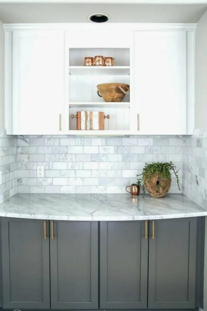 White kitchen with a marble tabletop