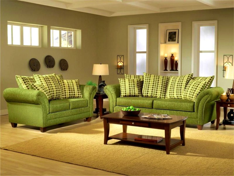 Green sofas in the interior of the living room