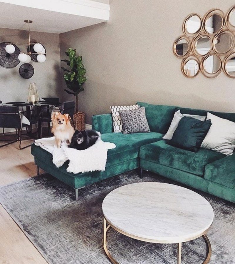 Interior with an emerald sofa