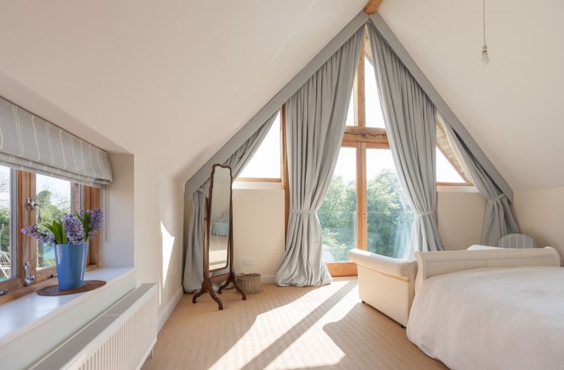 Curtains on the oblique window of attic