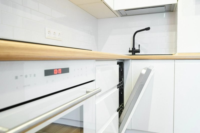 Kitchens with an integrated handle