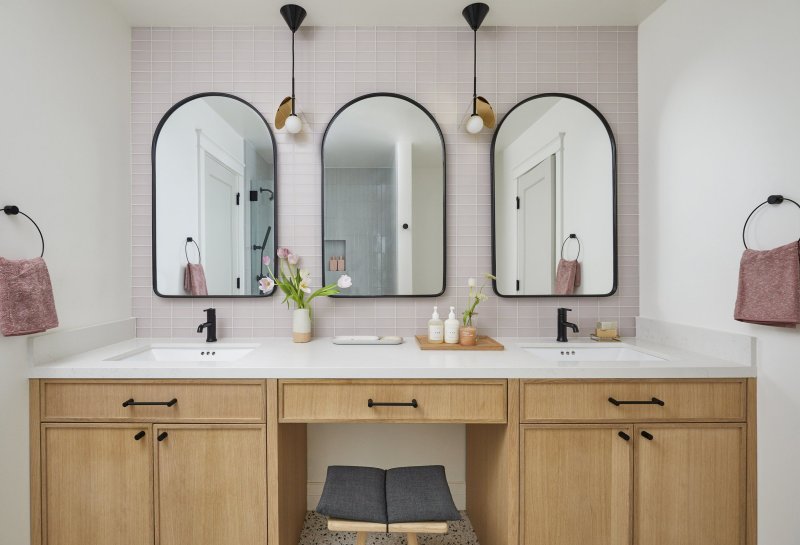 Round mirror over the sink