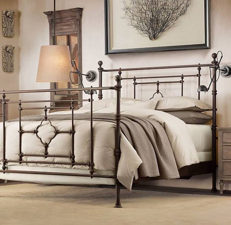 Metal bed in the interior of the bedroom