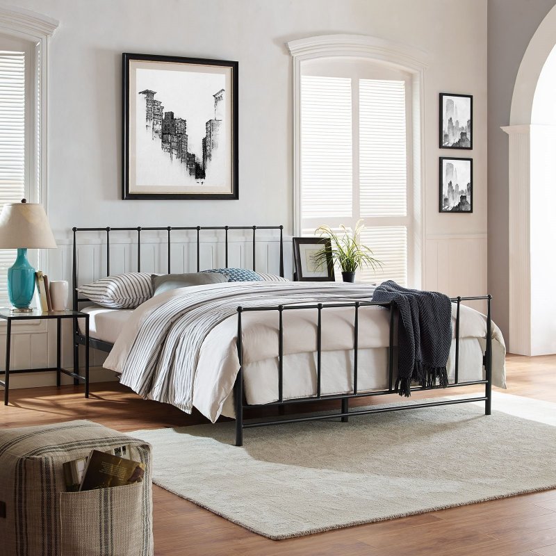 Metal bed in the interior of the bedroom