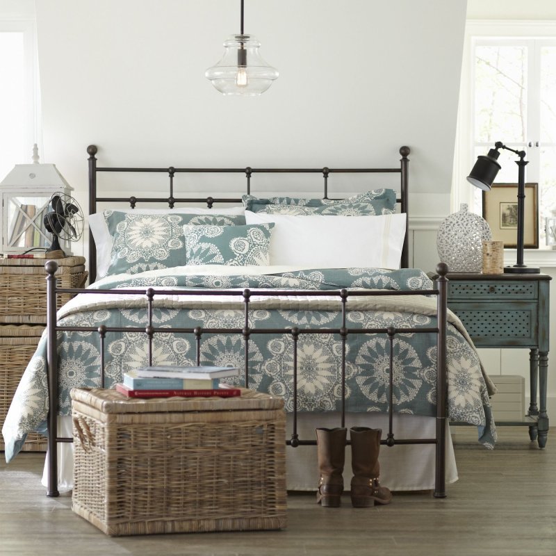 Metal bed in the interior of the bedroom