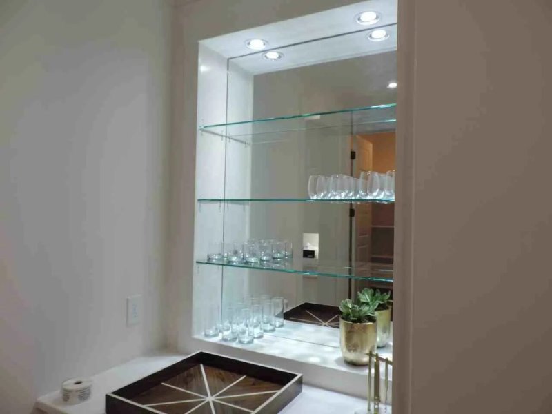 Glass shelves in a niche