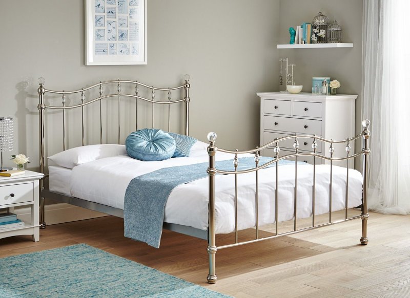 Metal bed in the interior of the bedroom